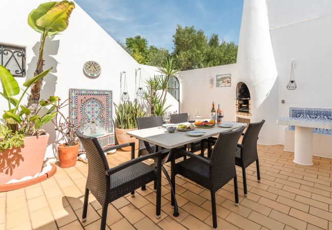 Portuguese tiles in a courtyard with barbecue